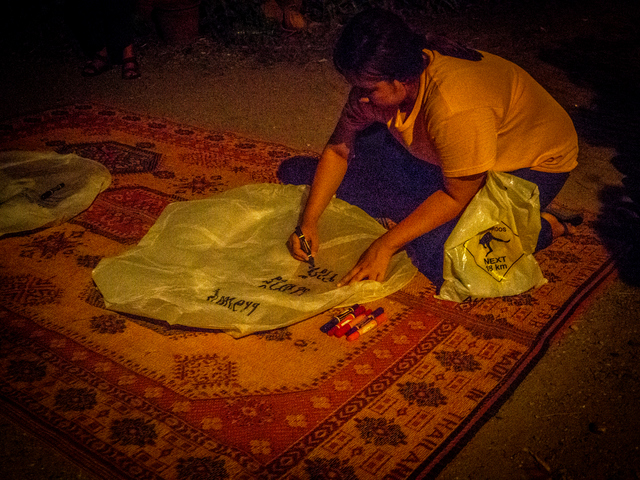 Our names and wishes being written onto the lanterns