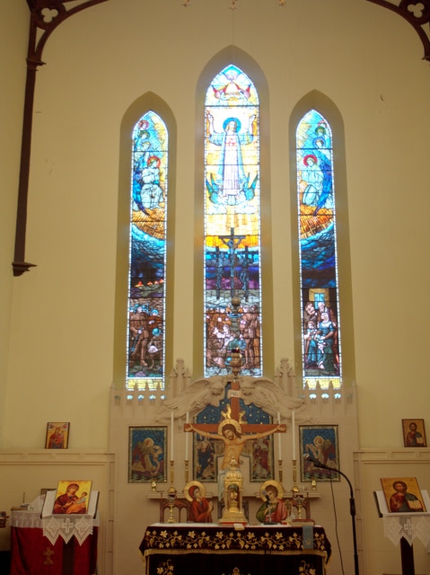 The altar and stained glass windows at Holy Trinity, North Hobart