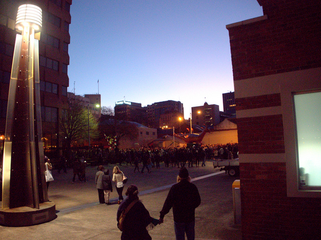 The procession moves through Hobart's waterfront precinct