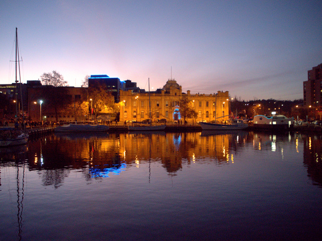 The procession passes the Tasmanian Museum and Art Gallery at sunset