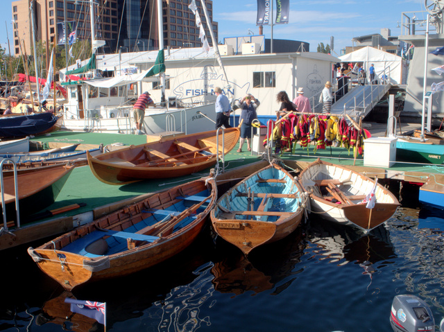 Visitors can put on a lifejacket and choose a wooden boat to row themselves around Constitution Dock