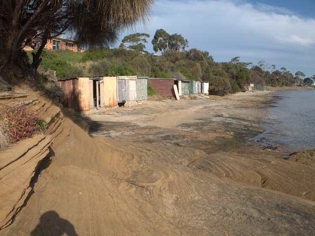 The boatsheds at Dodges Ferry have yet to be turned into second homes or leisure palaces