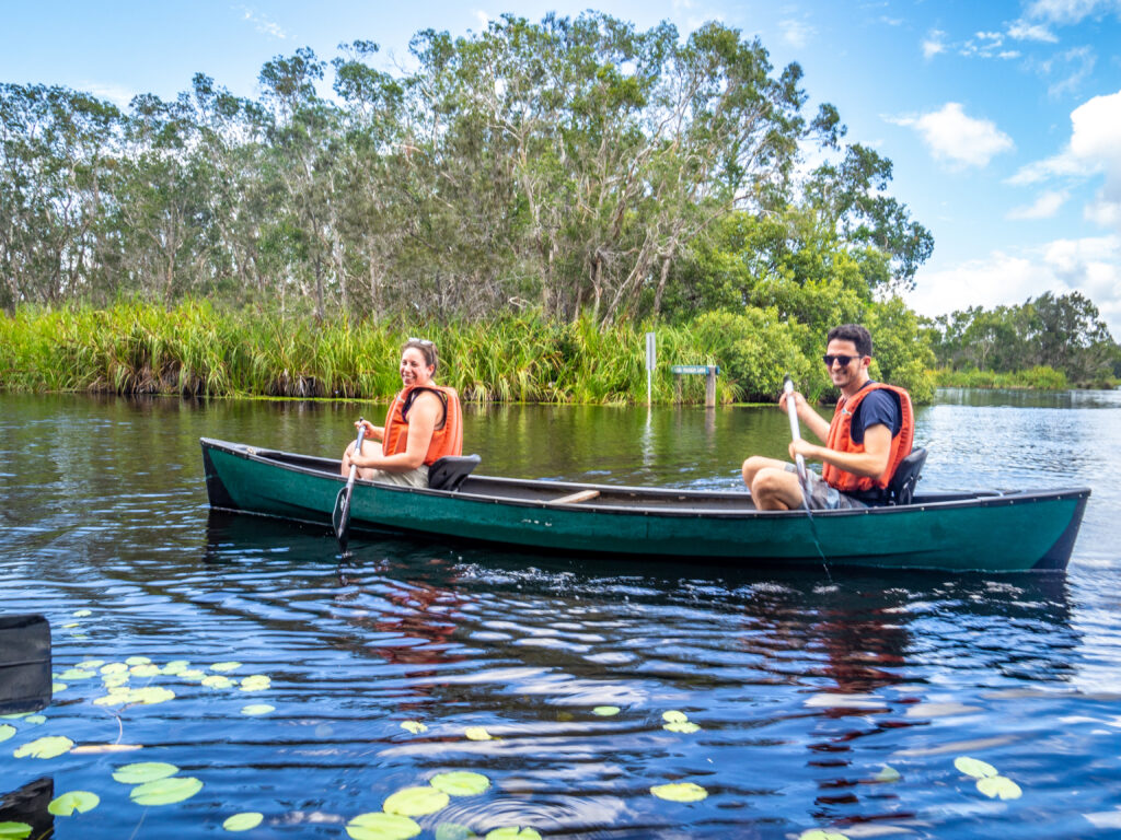 Happy kayakers setting off upstream