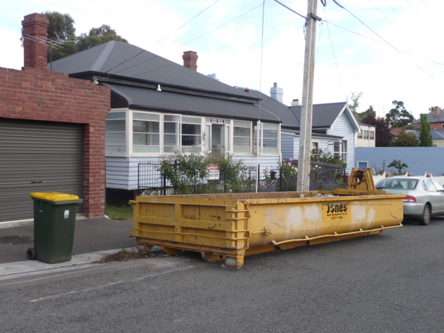 A huge skip was installed on the street outside