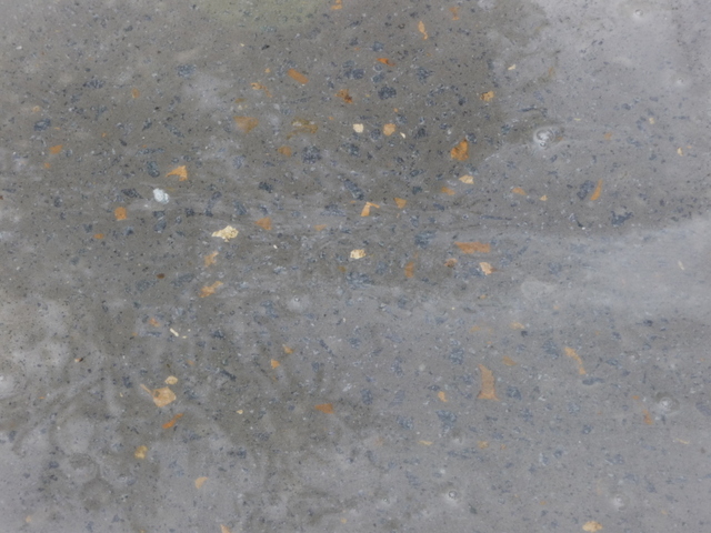 Little specks of gold aggregate will warm up the otherwise blue and grey of the concrete