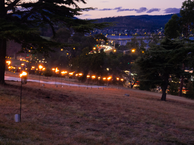 The Dark Path route across The Domain is lit by fire