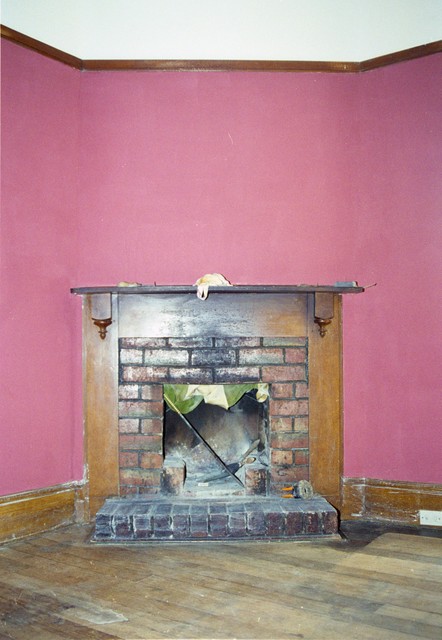 Fireplace in the freshly-painted loungeroom