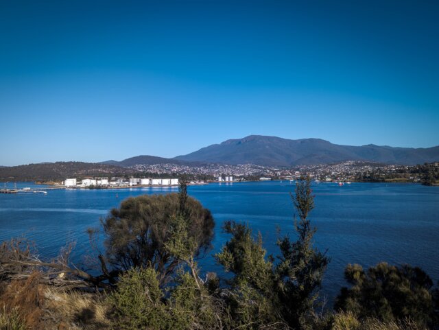 kunanyi / Mount Wellington above New Town Bay and the oil wharf directly across the river Derwent from Bedlam Walls and Shag Bay