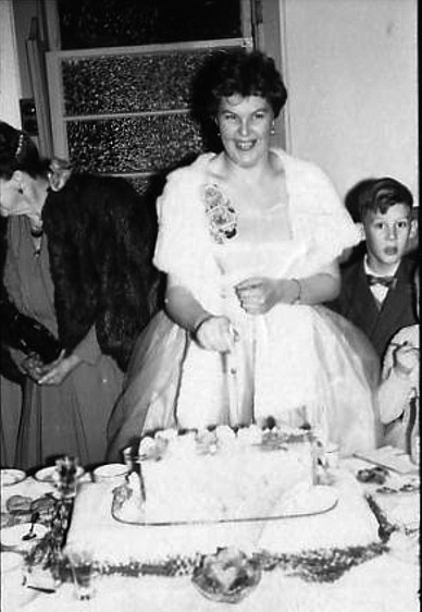 Mum cutting the cake at her twenty first birthday party