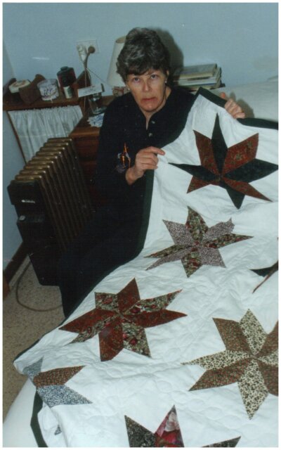 Mum with one of her quilts

